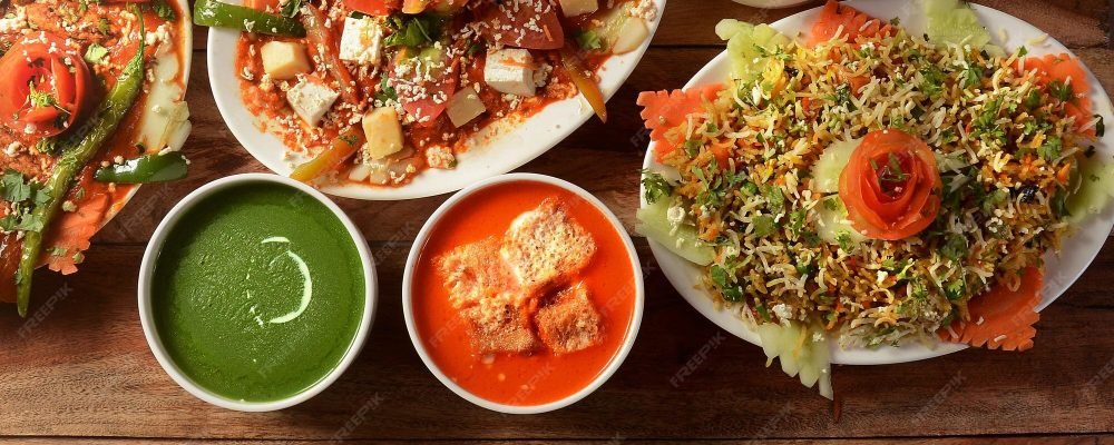 assorted-indian-food-wooden-background-dishes-appetizers-indian-cuisine_726363-341